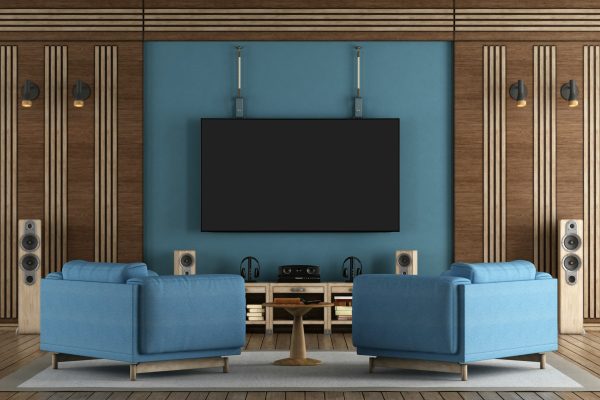 Home cinema room with TV hanging on blue wall